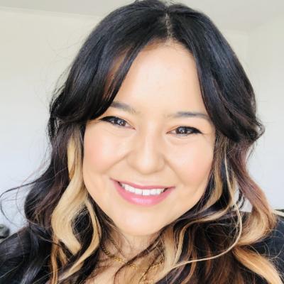 Headshot of Priscilla Leiva smiling at the camera